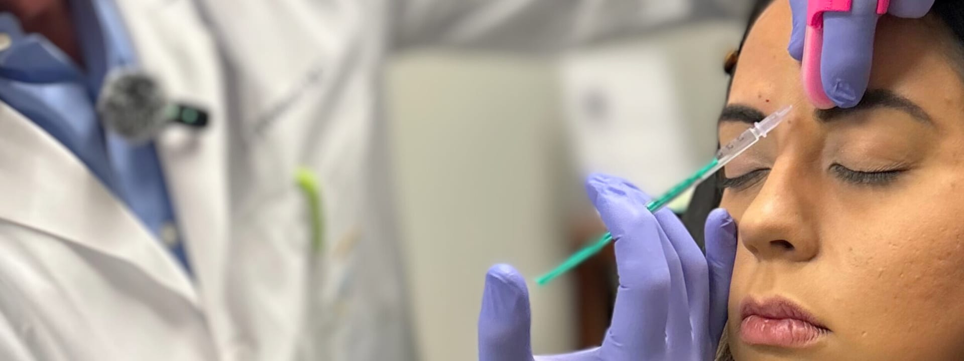 Dr. Stewart injecting Botox into a patient’s forehead