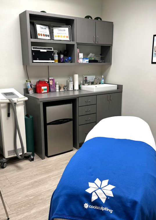 A treatment room at Pure Radiance with a CoolSculpting treatment chair
